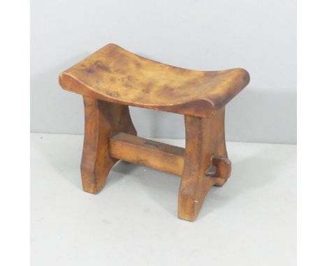 An Arts & Crafts teak stool by R B Richards & Sons, Castle Foregate Saw Mills, Shrewsbury, with maker's metal plaque. 47x39x2