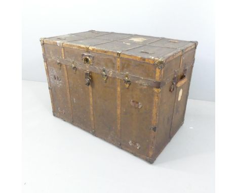 An antique leather covered and brass mounted trunk, labelled ER to side. 103x71x58cm 