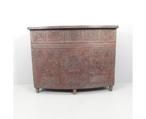 A mid-century Peruvian tooled leather clad bar, with embossed Aztec design. 143x109x61cmGood original condition with no obvio