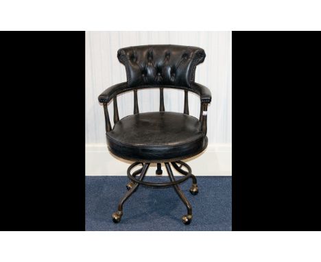 A Modern Captains Chair Office/captains swivel chair raised on industrial style base with castors, button back, upholstered i
