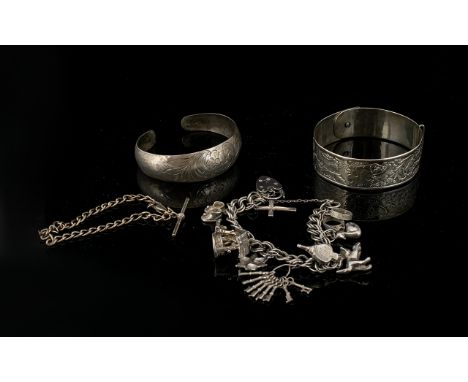 A Collection Of Silver Jewellery Items Total weight, approx 78.5 grams. To include Anglo Indian etched cuff, charm bracelet w