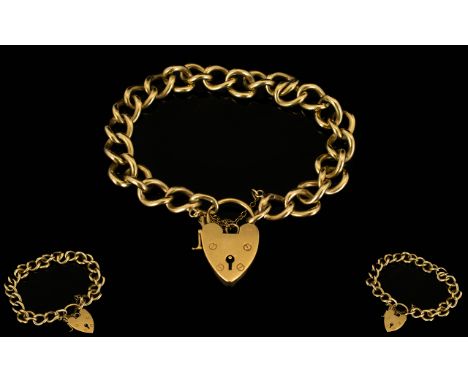 9ct Gold Heavy Curb Bracelet with Attached 9ct Gold Shield Shaped Padlock and Safety Chain. All Marked for 9ct Gold. Please S