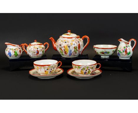 Japanese Part Tea Service Comprising teapot, two cups and accompanying saucers, sugar bowl and milk jug. Iron red with figura