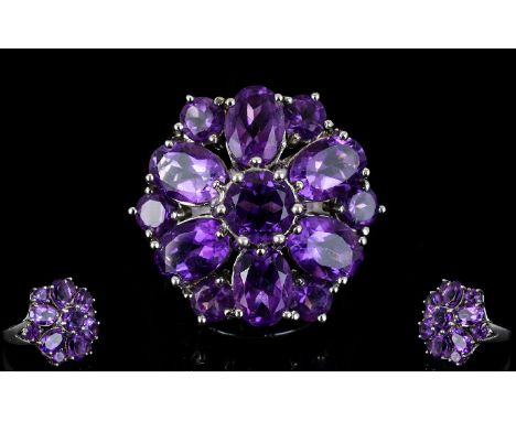 A Sterling Silver And Amethyst Set Statement Ring Exaggerated flowerhead setting with 4.41cts of deeply saturated amethyst. V