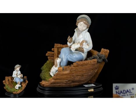 Nadal - Lladro Style Fine Quality Hand Painted Porcelain Figurine - Young Boy with puppies sitting in a fishing boat, raised 