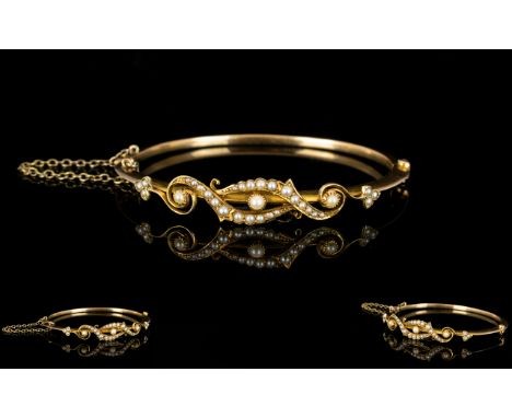 Victorian Period - Well Designed 15ct Gold Hinged Bangle with Safety Chain, Set with Seed Pearls of Excellent Quality and Con
