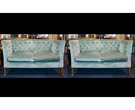 A Pair Of Two Seater Button Back Settee's High back sofas with button arms, backs and deep seats with drop in cushions. Each 