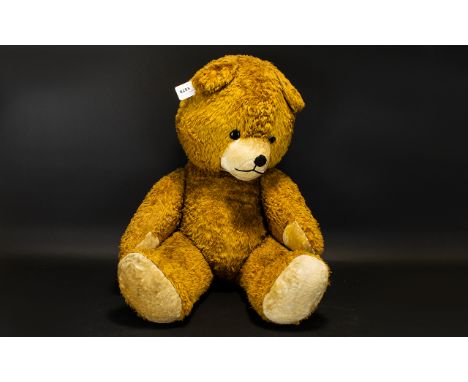 A Large Vintage Jointed Teddy Bear Of traditional construct with oversized head, black button eyes, cream velvet muzzle and p