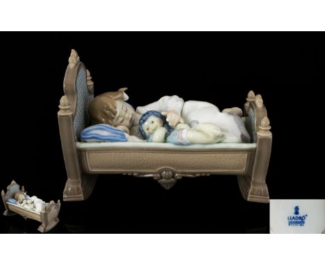 Lladro Porcelain Figurine '' Rock - A - Bye Baby ' Model No 5717. Issued 1990 - Retired 1999. Sculptor Francisco Polope. 1st 