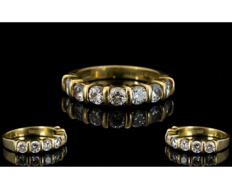 18ct Yellow Gold Diamond Set Half Eternity Ring of Attractive Form. Fully Hallmarked for 750 - 18ct. The Seven Brilliant Cut 