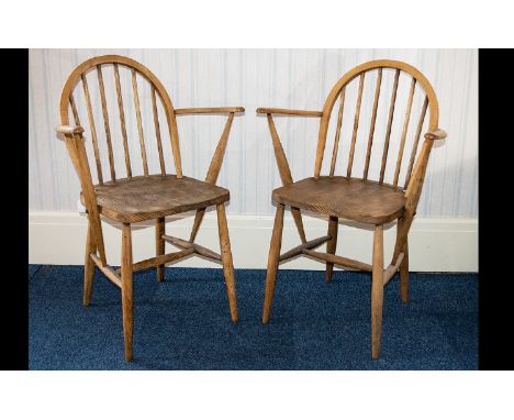 Ercol A Pair Of 1970's Elm/Ash Windsor Armchairs Each in good condition, impressed marks to back ' F.182, 290' curved seat ba