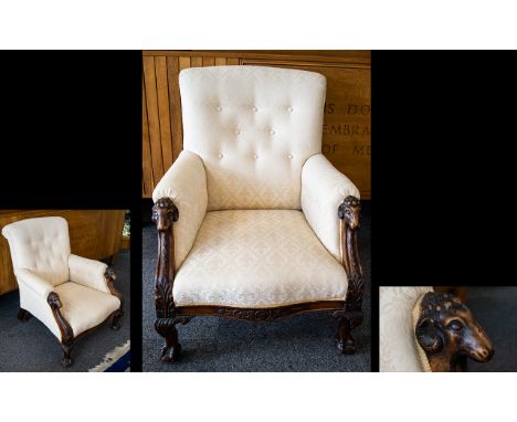 Ladies Button Back Low Armchair With carved rams head supports and claw feet. Upholstered in pale gold lattice jacquard fabri
