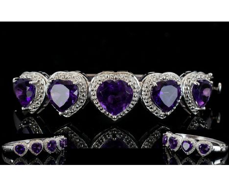 Amethyst Heart Cut Hinged Bangle, five heart cut deep purple amethysts graduating from the central 4.75ct stone, to either si