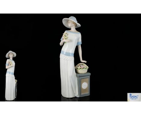 Nadal - Lladro Style Fine Quality Hand Painted Porcelain Figurine - Tall Elegant Lady Standing by a Display Stand with Basket