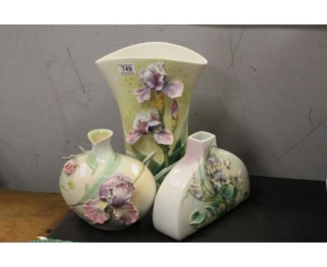 Three Franz Ceramic Vases, two with moulded Iris's and the other with Violets, largest 31cms high