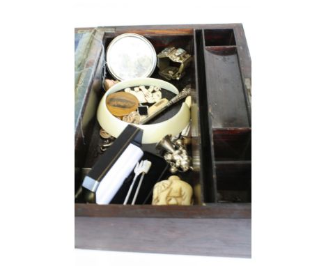 A wooden writing slope containing a selection of collectables to include hallmarked silver spoons, a white metal baby's rattl