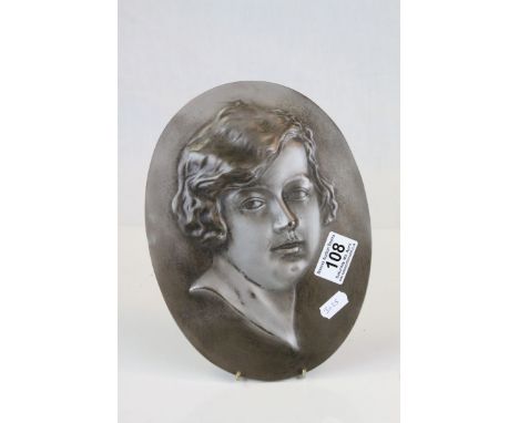 Art Deco Oval Silvered Metal Plaque with a Relief Portrait of a Girl, signed Lorenzl 1925, 25cms high
