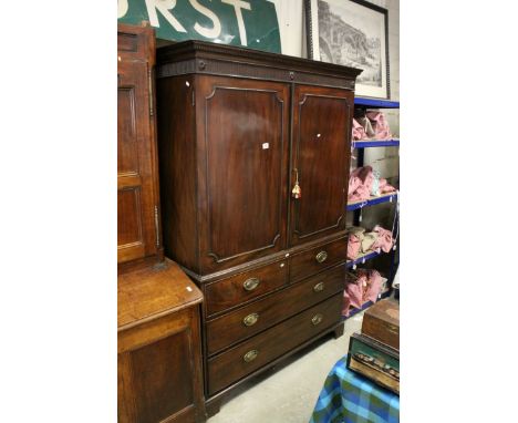 Early 19th century Mahogany Linen Press, the upper section with twin panel doors opening to reveal three linen slides, the lo