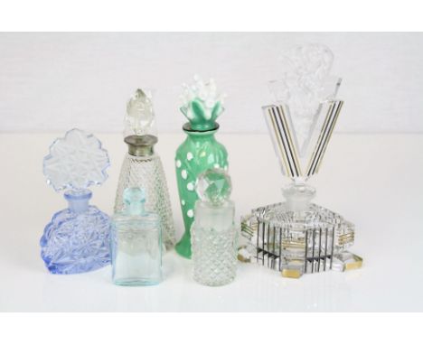 A collection of vintage glass and ceramic scent bottles