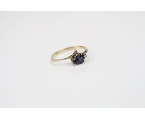 Yellow gold pear shaped sapphire and diamond ring 