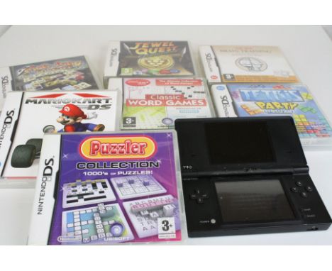 A Nintendo DS handheld games console together with a selection of games.