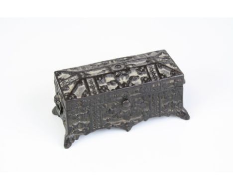 Antique pot metal trinket box in the form of a casket.