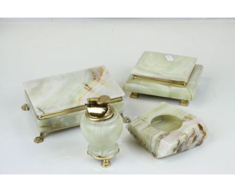 A collection of green onyx smoking related items to include cigarette boxes, ashtray and lighter.