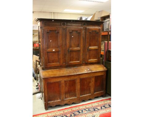 *18th century French Walnut Provincial Cupboard, the upper section with three cupboard doors above a hinged slope opening to 