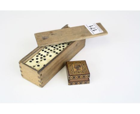 A set of bone double six dominoes together with a Tunbridge ware stamp box.