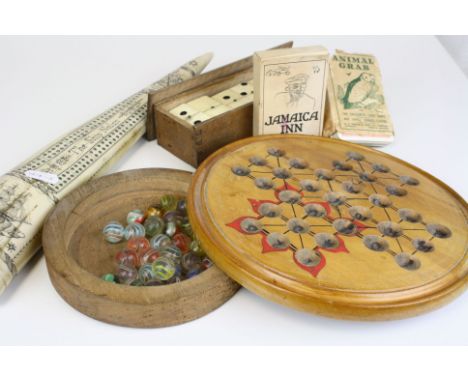 A box of mixed collectable games to include sollitaire, playing cards and dominoes, together with a scrimshaw resin tusk crib