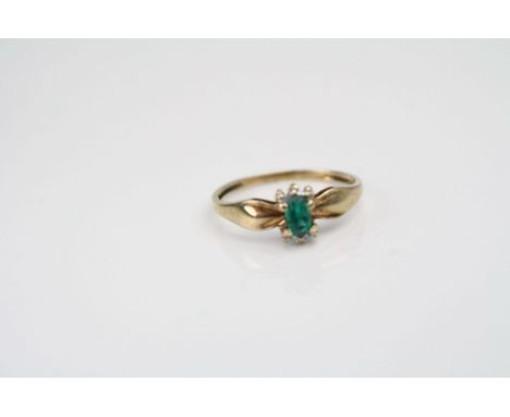 Yellow gold emerald and diamond ring 