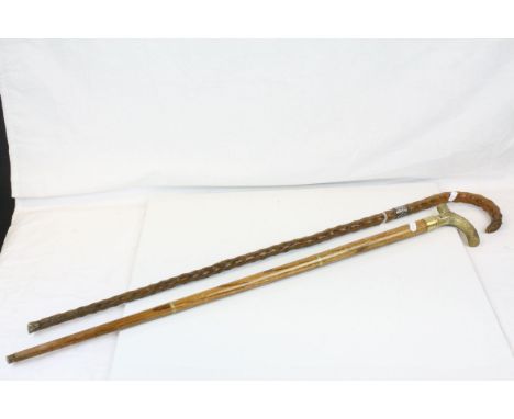 Two Walking Sticks, one natural wood with white metal ring and a Brass Handled one with sections that screw together