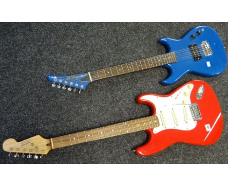 A red and white Tanglewood electric guitar and a blue Pulse electric guitar