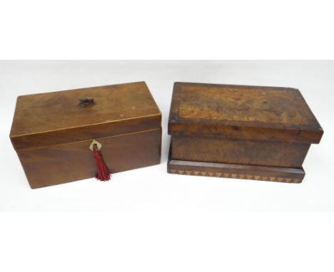 A Georgian mahogany tea-caddy with box-stringing borders, the hinged lid revealing three lidded compartments, 24cms wide; tog
