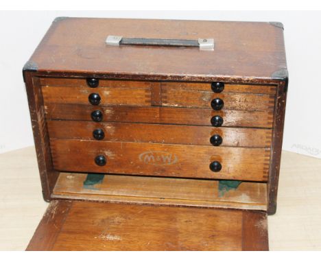 A wooden tool box and contents