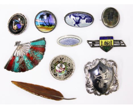 A group of vintage silver, butterfly wing and enamel brooches 