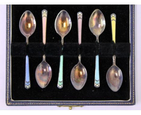 A cased set of silver hallmarked and enamel tea spoons retailed by Harrods