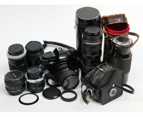 A Minolta camera and seven lenses