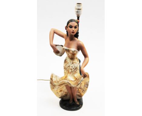 A vintage Spanish lady table lamp. H49cm