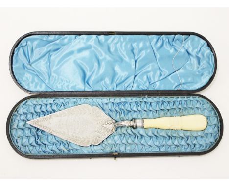 A hallmarked silver presentation trowel with ivory handle and box