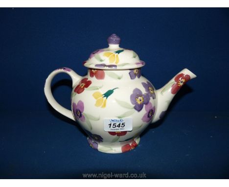 A pristine Emma Bridgewater teapot in wallflower pattern.