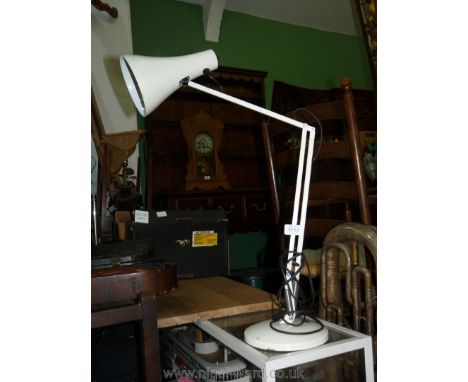 A white angle poise lamp.