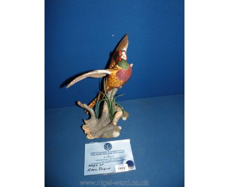 A well-modelled figure of ''The ring necked Pheasant'' sculpted by A.J. Rudisill in fine porcelain by Franklin Mint 1991, 12'