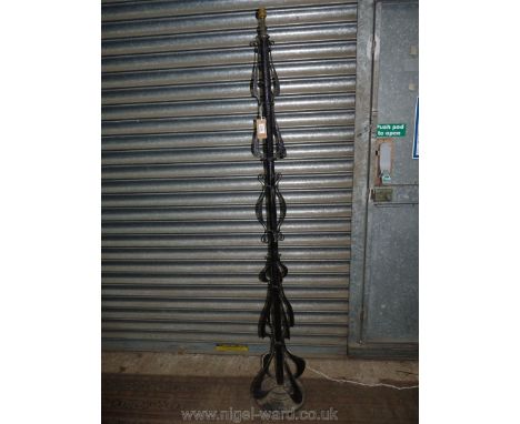 An Arts and Crafts wrought iron standard lamp, 70'' tall (no shade).