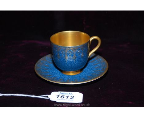 A pretty 1932 Royal Worcester coffee can and saucer, marbled blue ground with gilt highlights and gilt interior to the cup; V
