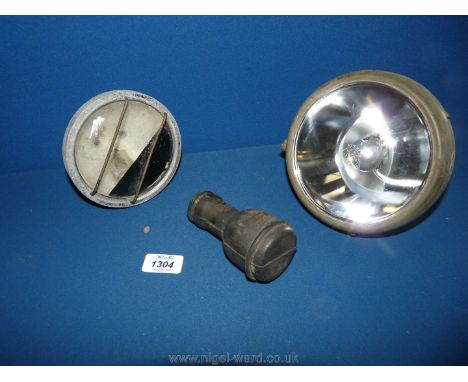 Two 1940's car or truck lamp assemblies with bulbs and a John Bull spare bulb holder.