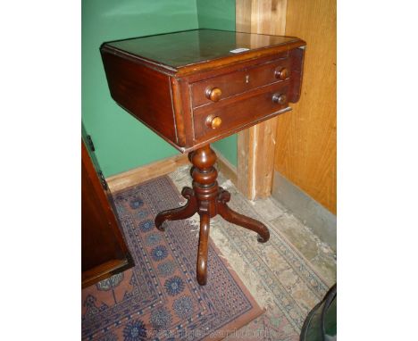 A circa 1900 mahogany Workbox Table having a deep double depth drawer simulating a stacked pair of drawers, with drop leaves 