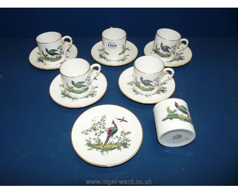 Six Royal Worcester coffee cans and saucers decorated with exotic pheasants.