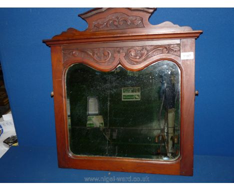 A late 19th c. carved Mahogany framed bevelled Mirror with ogee shape to top of mirror, 23'' high x 19 1/2'' wide