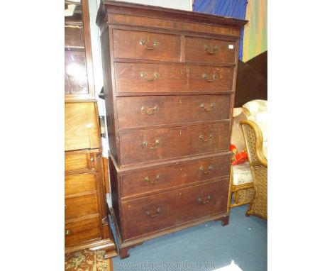 An Oak Chest on Chest, the base with one deep and one shallower long drawer, the upper section with three long and two short 